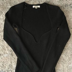 Black mini longe-sleeve sweater dress with small slit. Size M. Never worn.